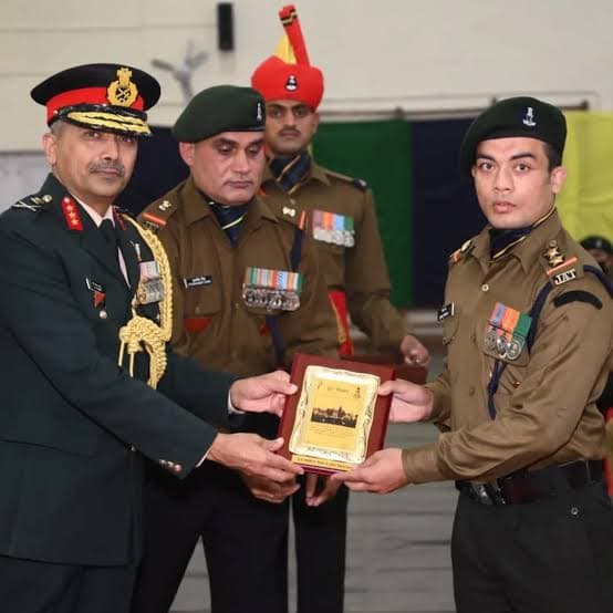 Evolve Fight Club's coach in Indian Army uniform being honoured by a senior officer